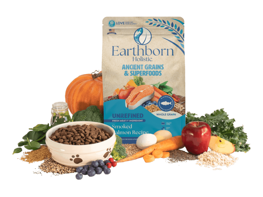 Earthborn Holistic Unrefined bag with bowl of kibble and fresh ingredients