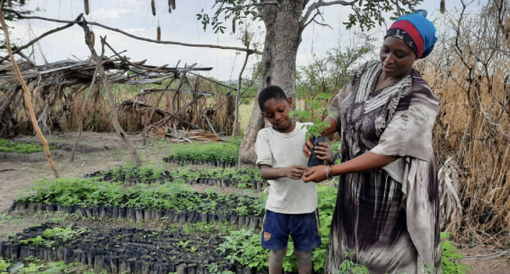 Forest garden farmer, Salma, and her son