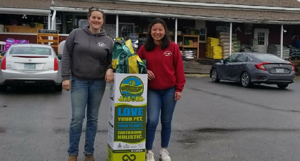 Henniker employees with their ReBorn recycling bin