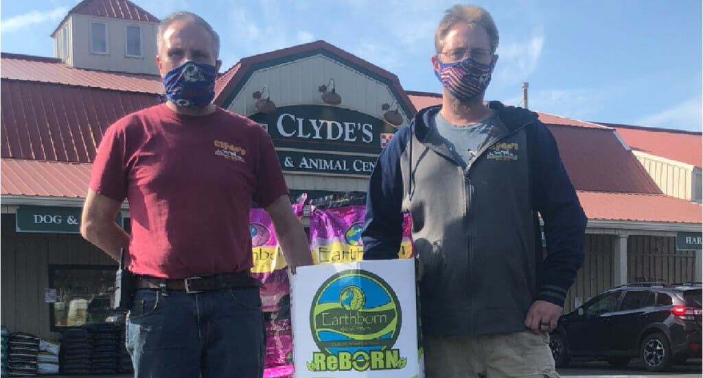 Clyde's Feed employees with their ReBorn recycling bin