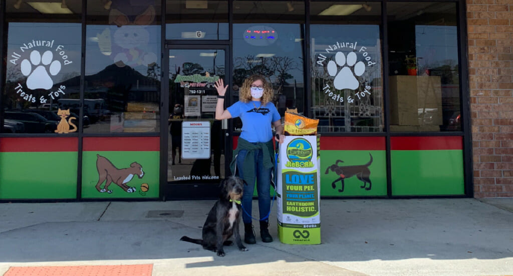 Aunt Kerry's Pet Stop employees with their ReBorn recycling bin