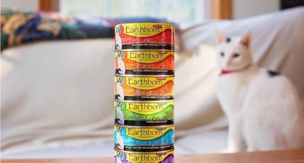 A stack of Earthborn Holistic canned cat food dinners