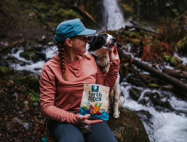 Person hands dog EarthBites Crunchy Salmon treat